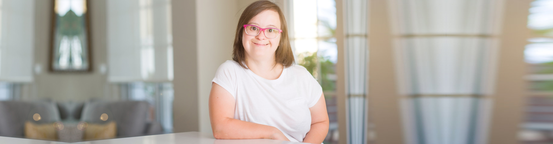 Down syndrome woman at home smiling